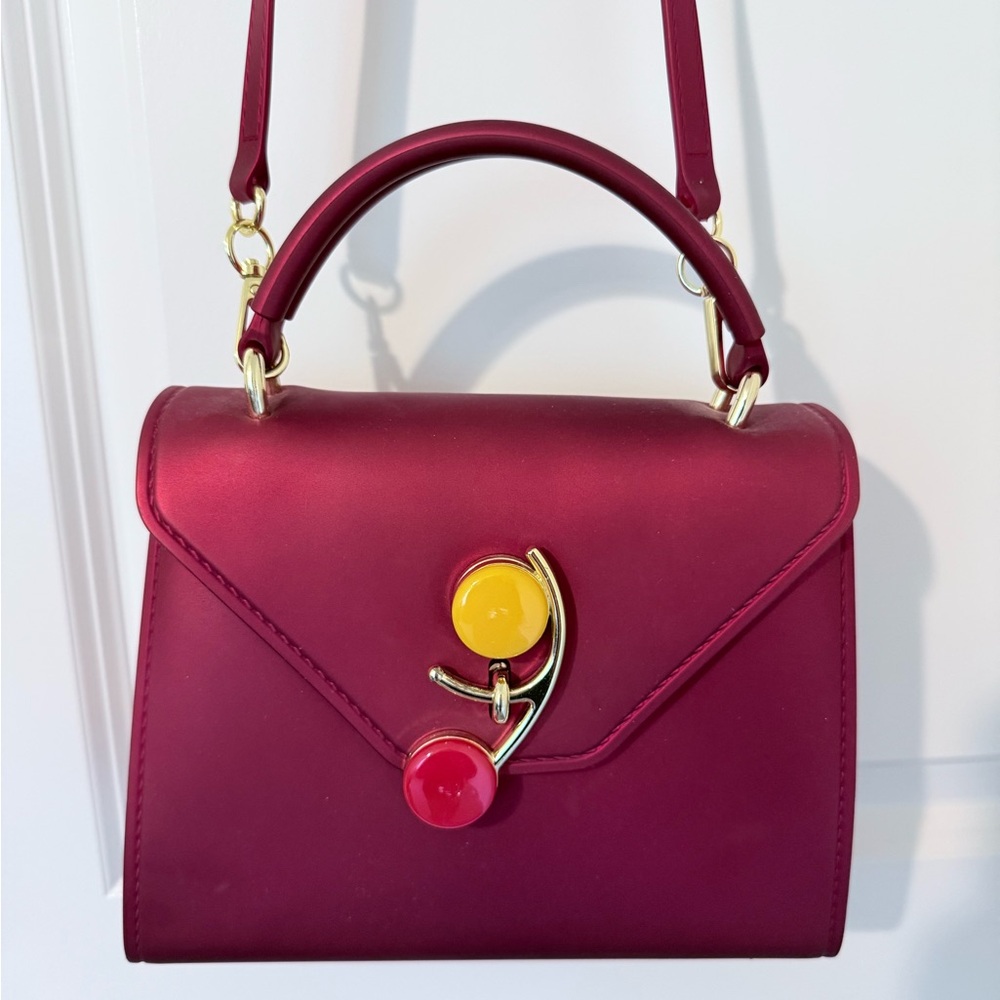 Elegant Burgundy Handbag with Artistic Accents